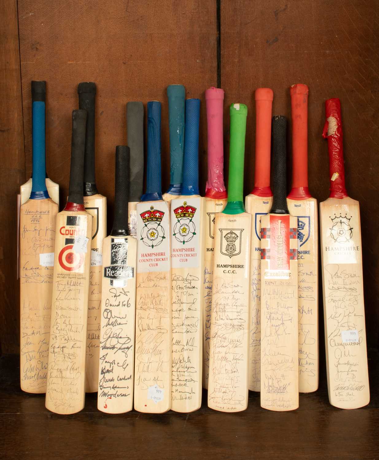 Lot 40 - A collection of miniature cricket bats