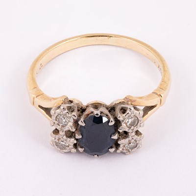 Lot 14 - A yellow metal sapphire and diamond dress ring