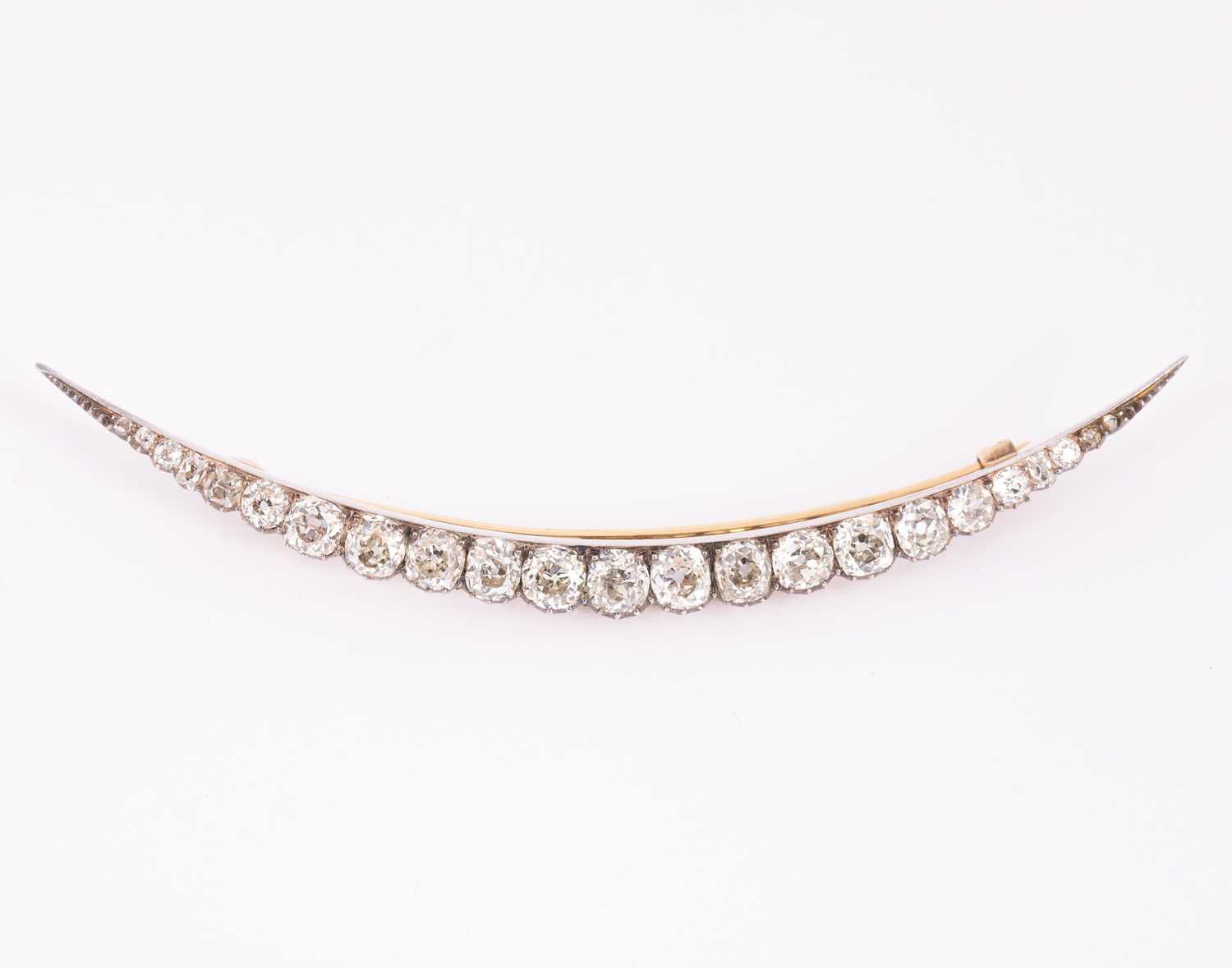 Lot 4 - A Victorian diamond set crescent brooch