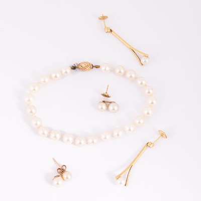 Lot 10 - A pair of yellow metal diamond and pearl drop earrings