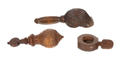 Lot 865 - Three treen nutcrackers