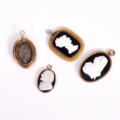 Lot 649 - Four glass cameo portraits in the manner of James Tassie