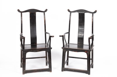 Lot 762 - A pair of Chinese ebonised yoke back armchairs
