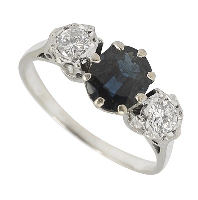 Lot 658 - A white gold sapphire and diamond three stone ring