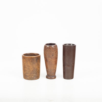 Lot 869 - A group of treen mortars and a pestle