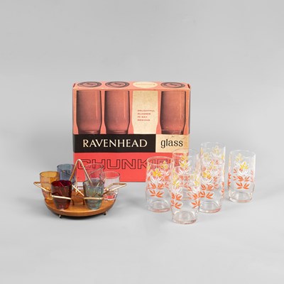 Lot 82 - A 1960s Wyncraft teak stand with a set of six coloured shot glasses
