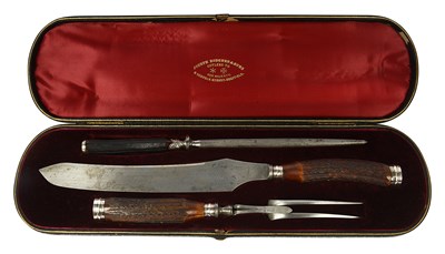Lot 585 - A three-piece carving set
