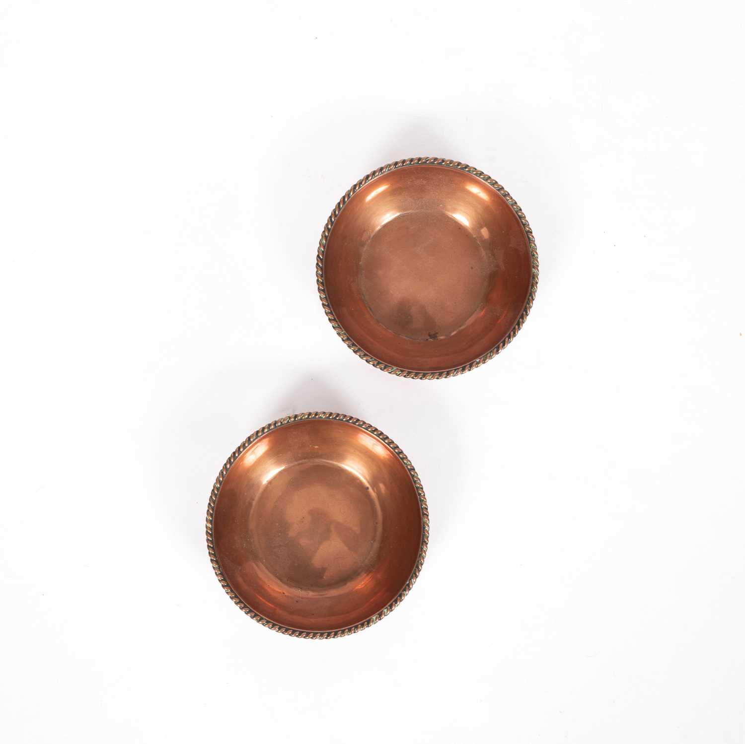 Lot 7 - A pair of Arts & Crafts copper dishes by Gordon Russell (1892-1980)