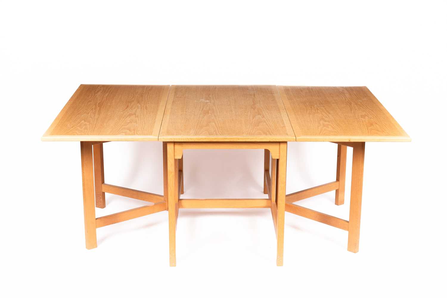 Lot 11 - An Arts & Crafts style oak dropleaf table