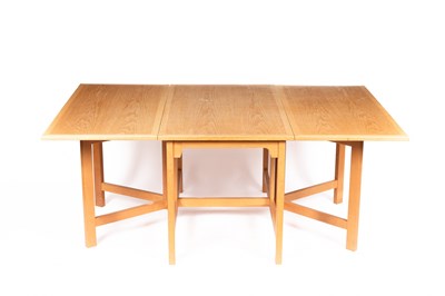 Lot 11 - An Arts & Crafts style oak dropleaf table