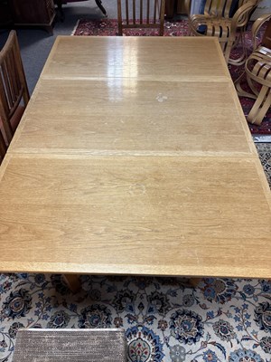 Lot 11 - An Arts & Crafts style oak dropleaf table
