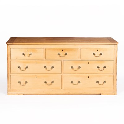 Lot 22 - A large pine chest of drawers