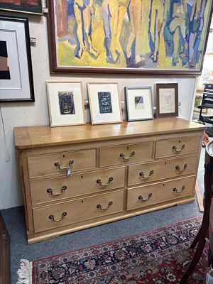 Lot 22 - A large pine chest of drawers