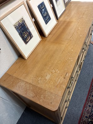 Lot 22 - A large pine chest of drawers