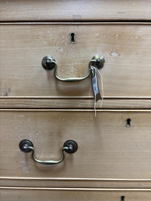 Lot 22 - A large pine chest of drawers