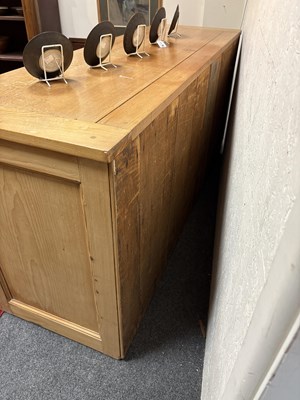 Lot 22 - A large pine chest of drawers