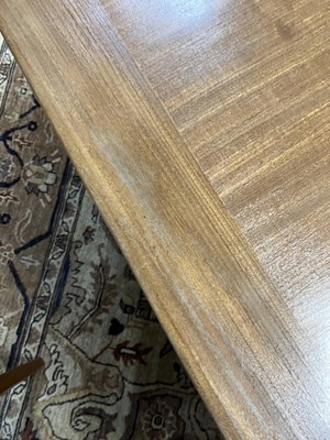 Lot 46 - A teak rectangular extending dining table and a set of four matching chairs