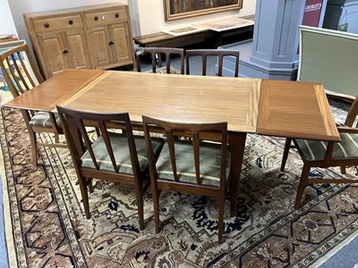 Lot 46 - A teak rectangular extending dining table and a set of four matching chairs