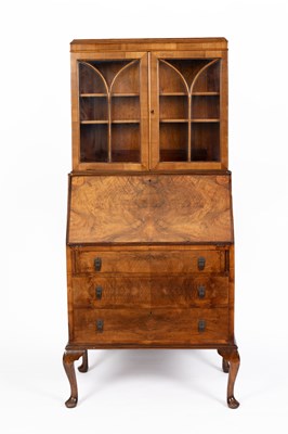 Lot 727 - A walnut bureau bookcase