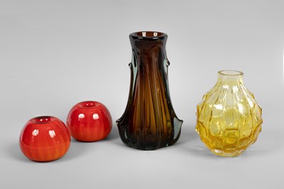 Lot 113 - A pair of red globular glass candle holders