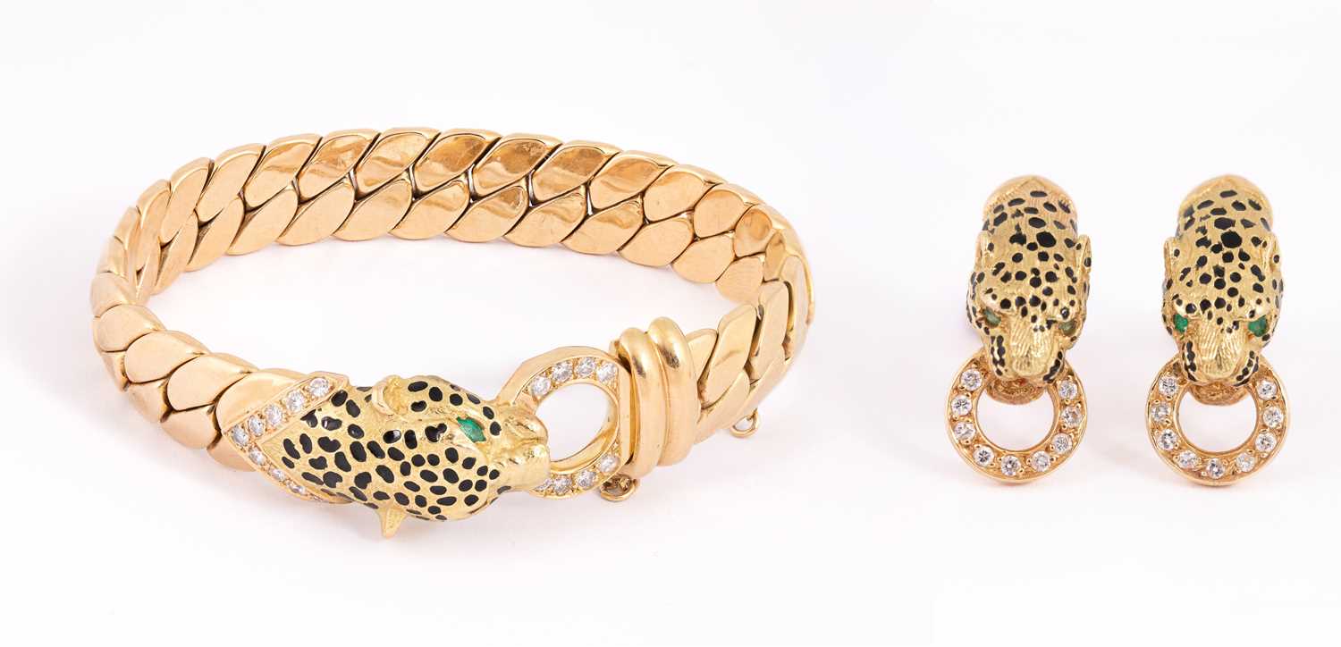 Lot 1 - Manner of Cartier: A Panthere style 18ct gold, diamond, emerald and enamel bracelet and earrings
