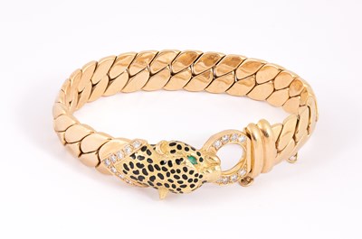 Lot 1 - Manner of Cartier: A Panthere style 18ct gold, diamond, emerald and enamel bracelet and earrings