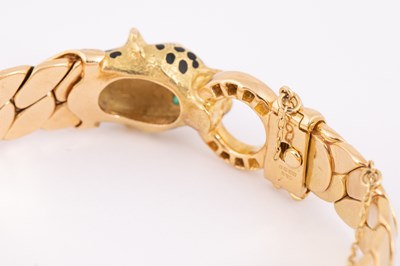 Lot 1 - Manner of Cartier: A Panthere style 18ct gold, diamond, emerald and enamel bracelet and earrings
