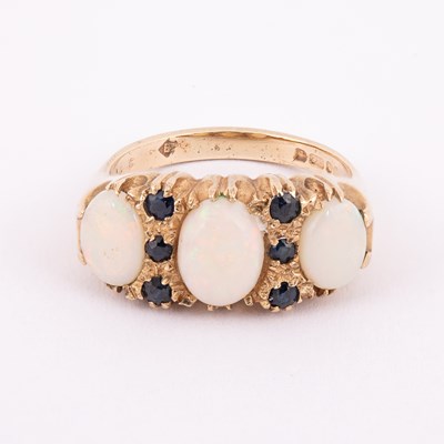Lot 58 - A 9ct yellow gold opal and sapphire dress ring