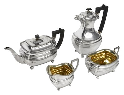 Lot 572 - A silver and silver-gilt three piece tea service