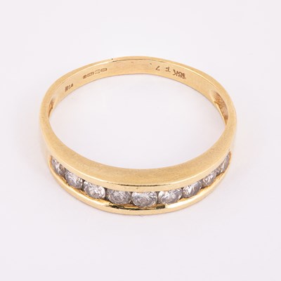 Lot 57 - An 18ct yellow gold and diamond half eternity ring