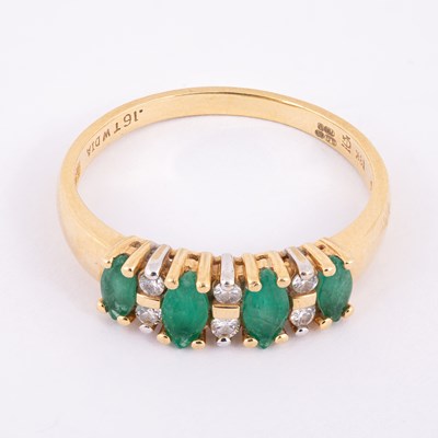 Lot 62 - An 18ct yellow gold emerald and diamond ring
