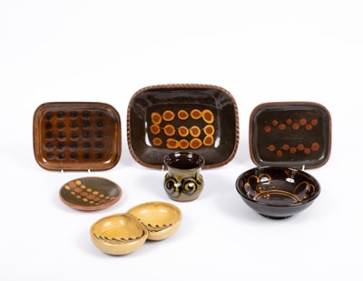 Lot 385 - Four mid 20th Century brown slipware dishes
