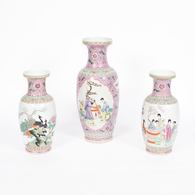 Lot 855 - A garniture of three Chinese famille rose vases