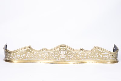 Lot 888 - A 19th Century serpentine brass fire curb