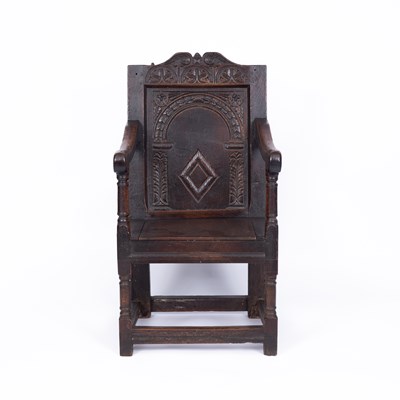 Lot 743 - A carved oak wainscot chair