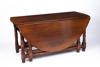Lot 772 - A 17th Century style oak drop-leaf gate leg table
