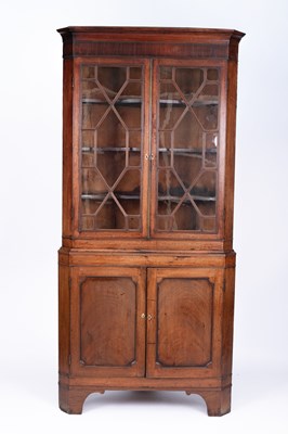 Lot 776 - A George III mahogany floor standing corner cupboard