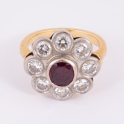Lot 26 - A ruby and diamond cluster ring
