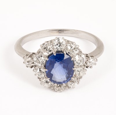 Lot An early 20th century sapphire and diamond oval cluster ring