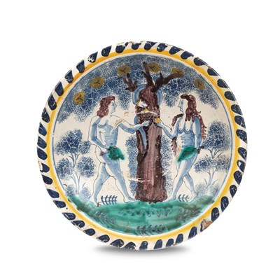 Lot An English delftware Adam & Eve blue dash charger