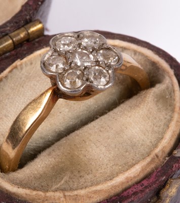 Lot 76 - An Edwardian 18ct gold and diamond flower head ring