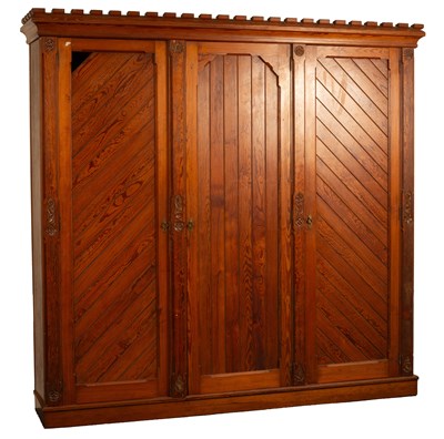 Lot 233 - An Aesthetic movement pitch pine triple wardrobe