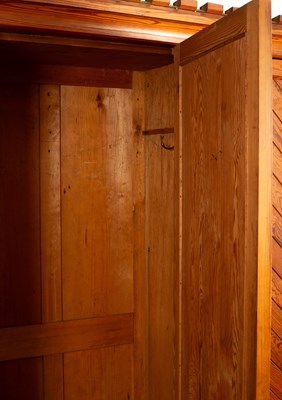 Lot 348 - An Aesthetic movement pitch pine triple wardrobe