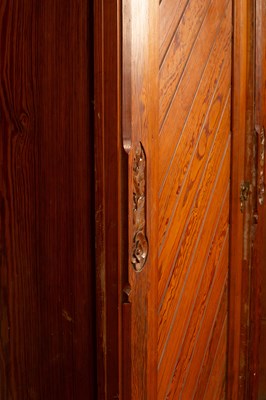 Lot 348 - An Aesthetic movement pitch pine triple wardrobe