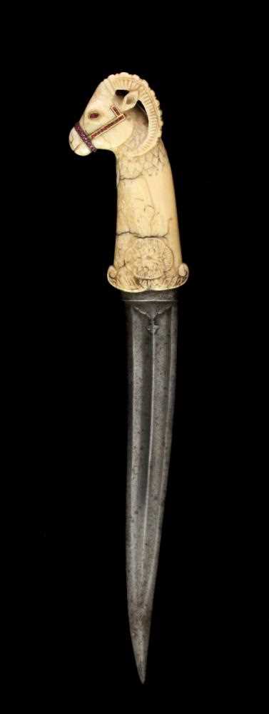 Lot 1031 - A Mughal dagger with ram's head handle in...